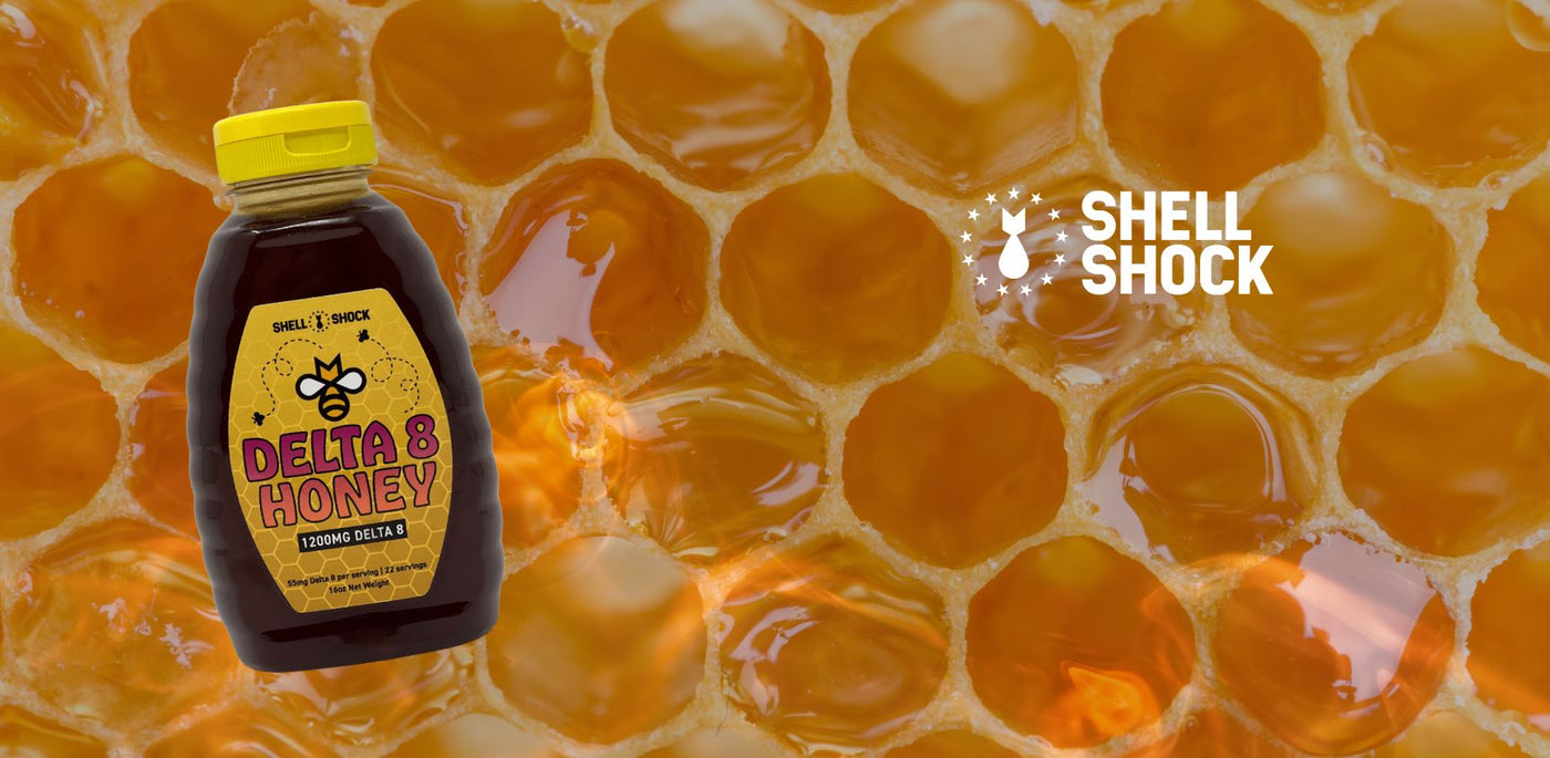 Honey crystals in background with jar of honey and shell shock logo