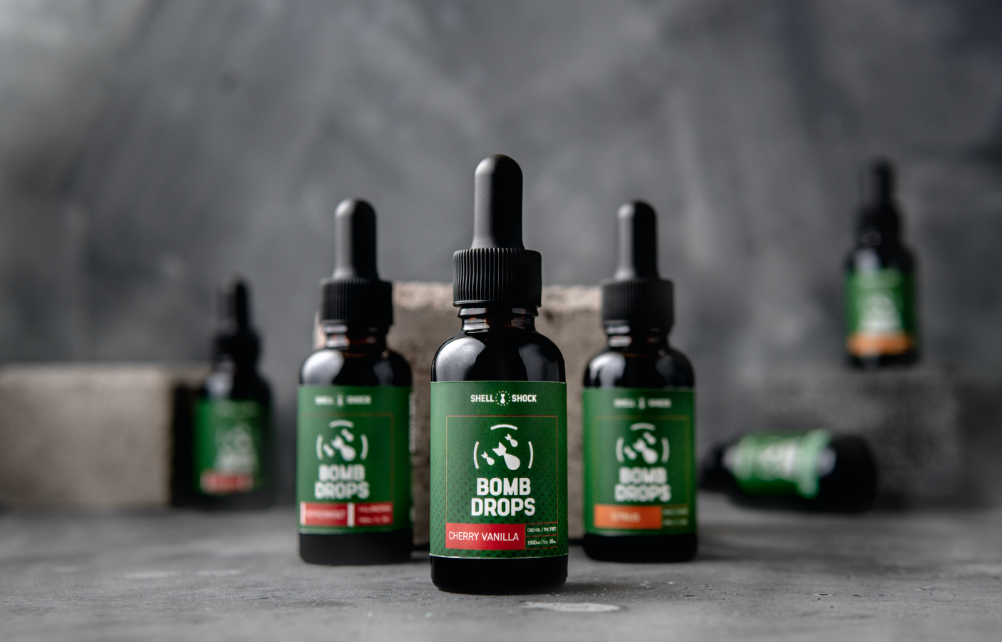 bottles of Shell Shock CBD Bomb drops in a variety of flavors