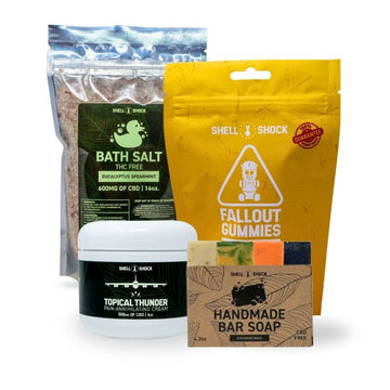 Collection of Shell Shock products including bath salt, gummies, cream, and soap on a white background